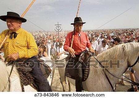 Procession during annual gipsy pilgrimage at Saintes-Maries-de-la-Mer, Camargue, France View Large Photo Image Stock Photograph - Procession during annual gipsy pilgrimage at Saintes-Maries-de-la-Mer, Camargue, France. Fotosearch