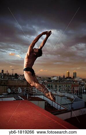 Stock Photograph - Professional Dancer striking a pose with the city of Barcelona in the background, Spain. Fotosearch