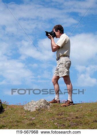 Professional Photographer with camera MR View Large Photo Image Stock Photo - Professional Photographer with camera MR. Fotosearch