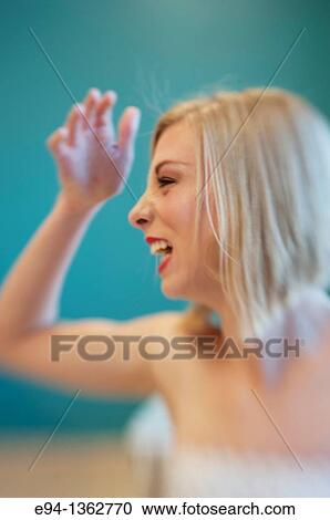 Profile 19 year old blond woman making a funny face View Large Photo Image Stock Image - Profile 19 year old blond woman making a funny face. Fotosearch