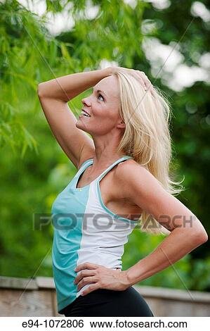 profile of 30 year old blonde woman in work out clothes View Large Photo Image Stock Photograph - profile of 30 year old blonde woman in work out clothes. Fotosearch