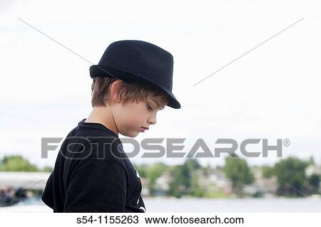 Profile of a ten-year-old boy wearing a hat outdoors. View Large Photo Image Stock Image - Profile of a ten-year-old boy wearing a hat outdoors.. Fotosearch