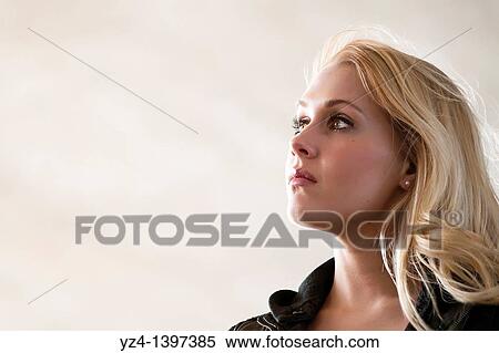 Profile of a young woman outdoors View Large Photo Image Stock Photography - Profile of a young woman outdoors. Fotosearch