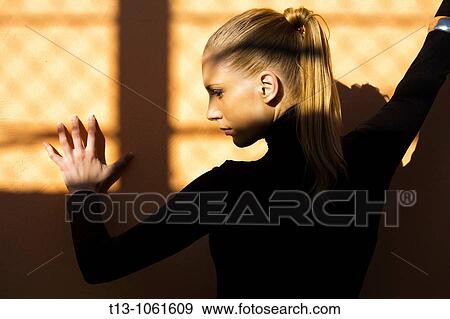 Stock Photo - Profile portrait of a young woman. Fotosearch