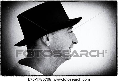 Profile Portrait of man with black hat View Large Photo Image Stock Photo - Profile Portrait of man with black hat. Fotosearch