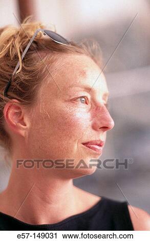 Profile portrait of woman with distant smile View Large Photo Image Stock Image - Profile portrait of woman with distant smile. Fotosearch