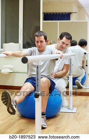Proprioception exercises knee, ankle, hip or back with medicine ball Gym Physiotherapy medical center, Donostia, San Sebastian, Gipuzkoa, Basque Country, Spain View Large Photo Image Stock Image - Proprioception exercises knee, ankle, hip or back with medicine ball Gym Physiotherapy medical center, Donostia, San Sebastian, Gipuzkoa, Basque Country, Spain. Fotosearch