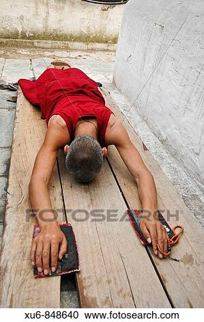 Prostrating Monk at Boudhanath Stupa Kathmandu, Nepal View Large Photo Image Stock Image - Prostrating Monk at Boudhanath Stupa Kathmandu, Nepal. Fotosearch