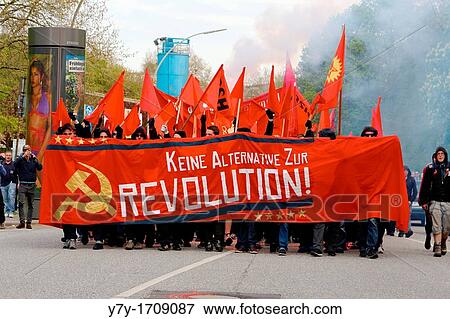 Protesters march through the smoke from their fireworks at the Mayday demonstration in Hamburg, Germany on May 1, 2012 View Large Photo Image Stock Photo - Protesters march through the smoke from their fireworks at the Mayday demonstration in Hamburg, Germany on May 1, 2012. Fotosearch