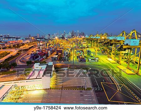 PSA Singapore Terminals is the world largest container transhipment hub, handling about one-fifth of the world's total container transhipment throughput View Large Photo Image Picture - PSA Singapore Terminals is the world largest container transhipment hub, handling about one-fifth of the world's total container transhipment throughput. Fotosearch
