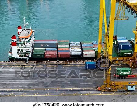 PSA Singapore Terminals is the world largest container transhipment hub, handling about one-fifth of the world's total container transhipment throughput View Large Photo Image Stock Image - PSA Singapore Terminals is the world largest container transhipment hub, handling about one-fifth of the world's total container transhipment throughput. Fotosearch