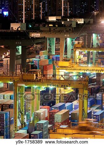 PSA Singapore Terminals is the world largest container transhipment hub, handling about one-fifth of the world's total container transhipment throughput View Large Photo Image Stock Photo - PSA Singapore Terminals is the world largest container transhipment hub, handling about one-fifth of the world's total container transhipment throughput. Fotosearch