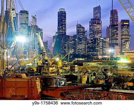 PSA Singapore Terminals is the world largest container transhipment hub, handling about one-fifth of the world's total container transhipment throughput View Large Photo Image Stock Photograph - PSA Singapore Terminals is the world largest container transhipment hub, handling about one-fifth of the world's total container transhipment throughput. Fotosearch