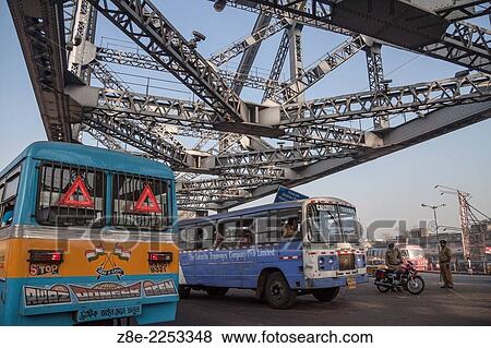 Public transport buses and other vehicles on Howrah bridge in Kolkata (Calcutta), West Bengal, India. Howrah bridge, commissioned by the British government in 1943 CE before India independence from British rule in 1945 CE View Large Photo Image Stock Photo - Public transport buses and other vehicles on Howrah bridge in Kolkata (Calcutta), West Bengal, India. Howrah bridge, commissioned by the British government in 1943 CE before India independence from British rule in 1945 CE. Fotosearch