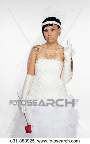 Punk Bride in her late 20s in a studio setting showing the finger View Large Photo Image Stock Photography - Punk Bride in her late 20s in a studio setting showing the finger. Fotosearch