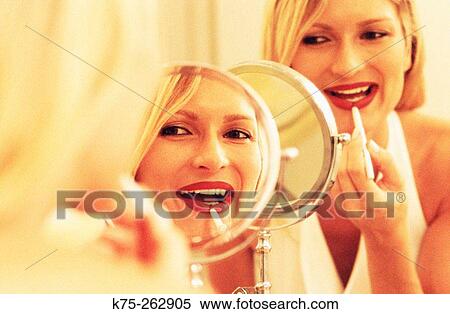 Putting on make-up View Large Photo Image Stock Photography - Putting on make-up. Fotosearch