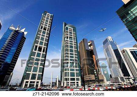 Qatar, Doha, West Bay, business district, street scene,. View Large Photo Image Stock Photograph - Qatar, Doha, West Bay, business district, street scene,.. Fotosearch