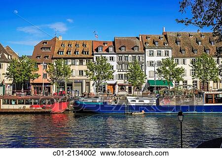 Quai des P? cheurs fishermen quay with barges on Ill river and waterfront houses Strasbourg Alsace France. View Large Photo Image Stock Image - Quai des P? cheurs fishermen quay with barges on Ill river and waterfront houses Strasbourg Alsace France.. Fotosearch