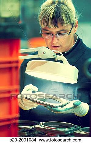 Quality control. Anchor flange particle filter. Machined Indecober. Machining of precision parts in series. Automotive industry. Berriz. Bizkaia. Basque Country. Spain. View Large Photo Image Picture - Quality control. Anchor flange particle filter. Machined Indecober. Machining of precision parts in series. Automotive industry. Berriz. Bizkaia. Basque Country. Spain.. Fotosearch