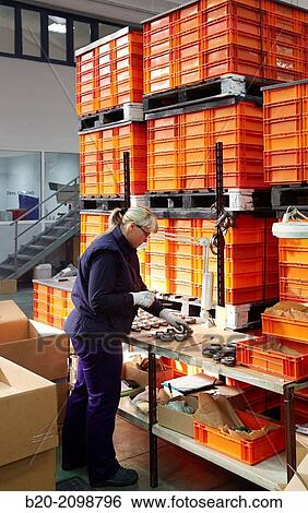 Stock Photograph - Quality control. Machined Indecober. Machining of precision parts in series. Automotive industry. Berriz. Bizkaia. Basque Country. Spain.. Fotosearch