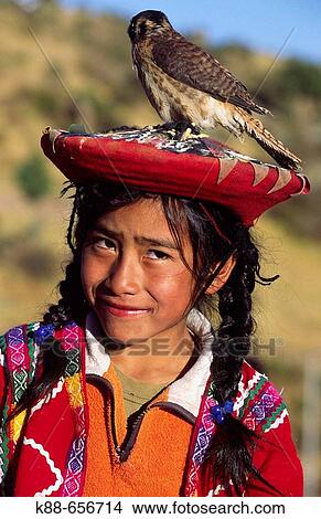 Picture - Quechua girl with bird. Near Cuzco, Peru. Fotosearch