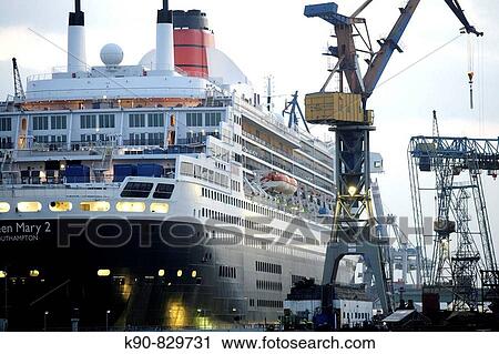 Stock Image - Queen Mary II laying in the dry dock of a Blohm & Voss shipyard in Hamburg, Northern Germany, Europe. Fotosearch