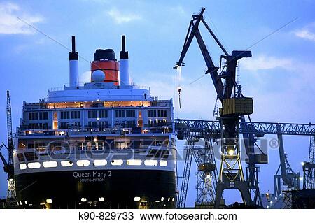 Queen Mary II laying in the dry dock of a Blohm & Voss shipyard in Hamburg, Germany, Europe View Large Photo Image Stock Image - Queen Mary II laying in the dry dock of a Blohm & Voss shipyard in Hamburg, Germany, Europe. Fotosearch