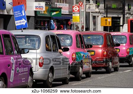 Queue of colourful London taxi cabs View Large Photo Image Stock Photo - Queue of colourful London taxi cabs. Fotosearch