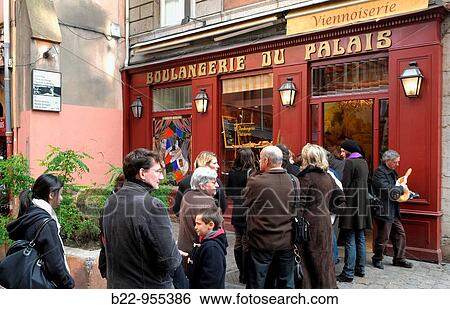 Stock Photograph - Queue outside the Boulangerie du Palais bakery, Lyon, Rh? ne, Rh? ne-Alpes, France. Fotosearch