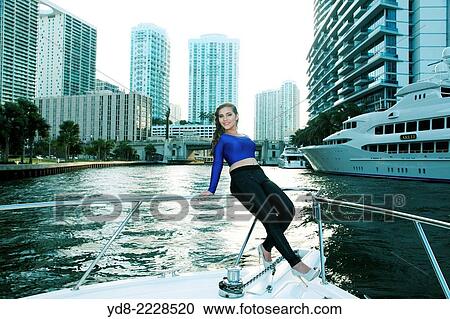 Quinceaera Young posing on the bow of a yacht off the coast of Miami, Florida, USA View Large Photo Image Stock Image - Quinceaera Young posing on the bow of a yacht off the coast of Miami, Florida, USA. Fotosearch