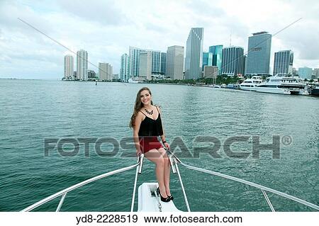 Quinceaera Young posing on the bow of a yacht off the coast of Miami, Florida, USA View Large Photo Image Stock Photo - Quinceaera Young posing on the bow of a yacht off the coast of Miami, Florida, USA. Fotosearch