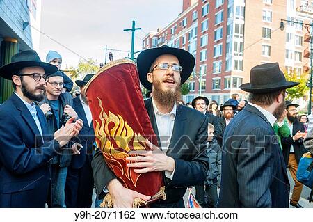 Rabbi Yossel Gansbourg of the Chabad of Harlem celebrates the completion of their Sefer Torah in a Torah parade Hachnasat Sefer Torah through the streets of Harlem in New York. View Large Photo Image Stock Image - Rabbi Yossel Gansbourg of the Chabad of Harlem celebrates the completion of their Sefer Torah in a Torah parade Hachnasat Sefer Torah through the streets of Harlem in New York.. Fotosearch