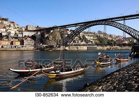 ? Rabelos? Port wine carring barges, Douro river and Dom Luis I Bridge, Porto, Portugal View Large Photo Image Picture - ? Rabelos? Port wine carring barges, Douro river and Dom Luis I Bridge, Porto, Portugal. Fotosearch