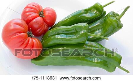 Stock Image - Raff tomatoes and italian peppers. Fotosearch