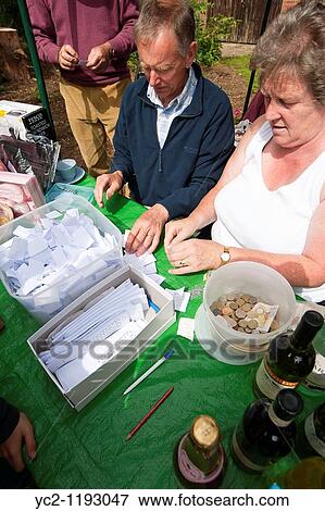 Raffle tickets being sold at a village fete in Weston, Suffolk, England, Great Britain, Uk View Large Photo Image Stock Photo - Raffle tickets being sold at a village fete in Weston, Suffolk, England, Great Britain, Uk. Fotosearch