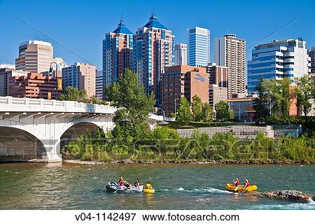 Rafting on the Bow River with the skyline in the background in Calgary, Alberta, Canada View Large Photo Image Stock Photo - Rafting on the Bow River with the skyline in the background in Calgary, Alberta, Canada. Fotosearch