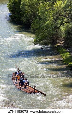 Rai or almadia raft La Pobla de Segur Diada dels Raiers ferrymen feast day Noguera Pallaresa river Pyr? n? es Lleida province Catalonia Spain View Large Photo Image Stock Photo - Rai or almadia raft La Pobla de Segur Diada dels Raiers ferrymen feast day Noguera Pallaresa river Pyr? n? es Lleida province Catalonia Spain. Fotosearch