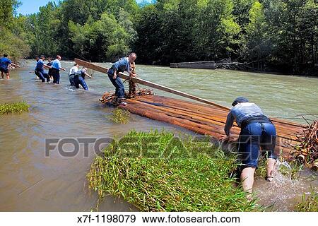Rai or almadia raft La Pobla de Segur Diada dels Raiers ferrymen feast day Noguera Pallaresa river Pyr? n? es Lleida province Catalonia Spain View Large Photo Image Stock Photo - Rai or almadia raft La Pobla de Segur Diada dels Raiers ferrymen feast day Noguera Pallaresa river Pyr? n? es Lleida province Catalonia Spain. Fotosearch