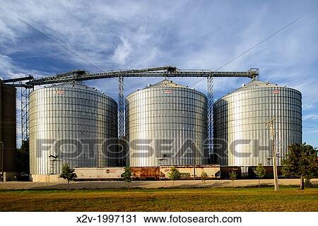Rail cars await loading at the Shakopee River Terminal grain storage bins in Shakopee, Minnesota, USA. View Large Photo Image Stock Image - Rail cars await loading at the Shakopee River Terminal grain storage bins in Shakopee, Minnesota, USA.. Fotosearch