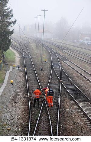 Rail track workers control View Large Photo Image Picture - Rail track workers control. Fotosearch