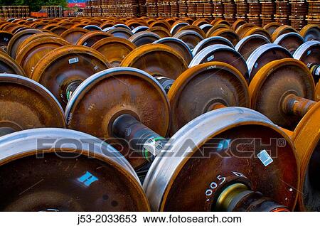 Stock Image - Railroad train wheel and axle assemblies at manufacturing plant, Tacoma, Washington USA.. Fotosearch