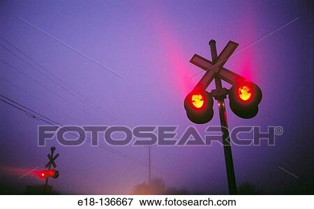 Stock Photo - Railway crossing signals on foggy morning in Ladner. Vancouver, British Columbia, Canada. Fotosearch
