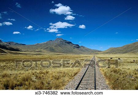 Railway track through the Andes mountain range, Puno to Cusco Perurail train journey, Peru View Large Photo Image Stock Image - Railway track through the Andes mountain range, Puno to Cusco Perurail train journey, Peru. Fotosearch