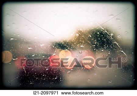 Rain drops on windshield. Blurred view of cars. View Large Photo Image Stock Image - Rain drops on windshield. Blurred view of cars.. Fotosearch