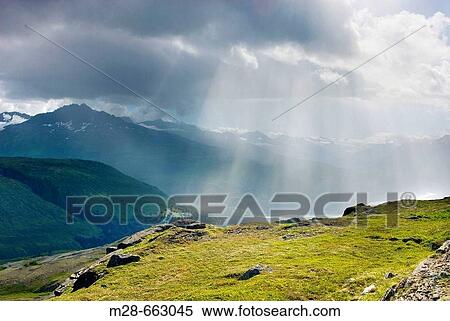 Stock Photography - Rain squall in the Chugach Mountains near Thompson Pass, Alaska, USA. Fotosearch