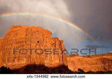 Rainbow arches above massive sandstone cliffs View Large Photo Image Stock Image - Rainbow arches above massive sandstone cliffs. Fotosearch
