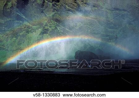 Rainbow near Skogafoss waterfall, Skogar village, Iceland View Large Photo Image Stock Image - Rainbow near Skogafoss waterfall, Skogar village, Iceland. Fotosearch