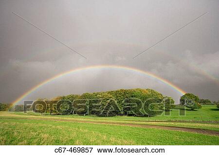 Rainbow, october afternoon. Bedfordshire. UK. View Large Photo Image Stock Photo - Rainbow, october afternoon. Bedfordshire. UK.. Fotosearch