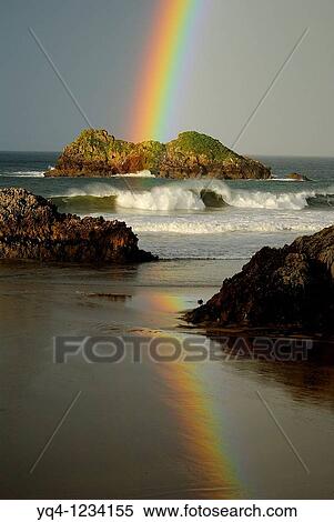 Stock Photography - Rainbow over the beach Celorio Llanes, Asturias. Fotosearch