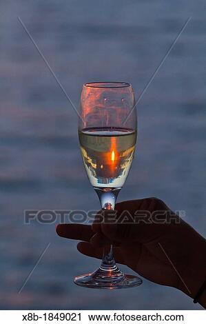 Raise a glass of champagne to the sunset over Sombrero Chino Island in the Galapagos Island Archipelago, Ecuador View Large Photo Image Stock Image - Raise a glass of champagne to the sunset over Sombrero Chino Island in the Galapagos Island Archipelago, Ecuador. Fotosearch
